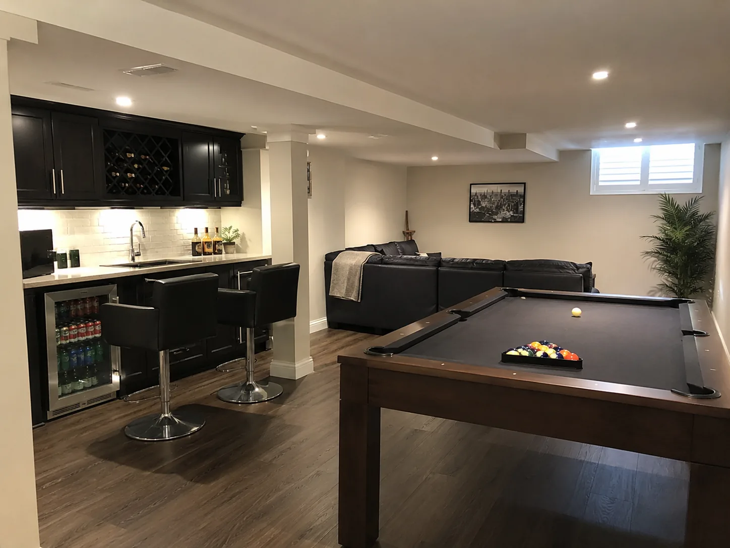 Finished basement family room with fireplace and built-in shelving in Richmond Hill